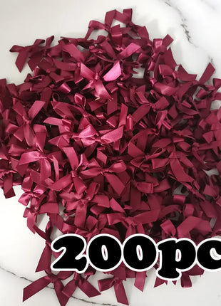 200 יח' סרטי סאטן ורוד – פפיונים קטנים לקישוט ויצירה