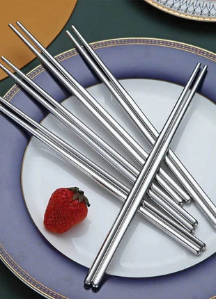  Professional-grade chopsticks with a sleek, modern design. Made from durable stainless steel for a high-end dining experience.