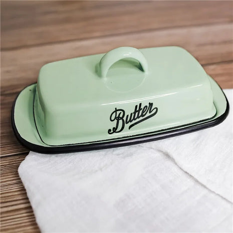 A nostalgic butter dish crafted from durable enamel, perfect for every kitchen.

