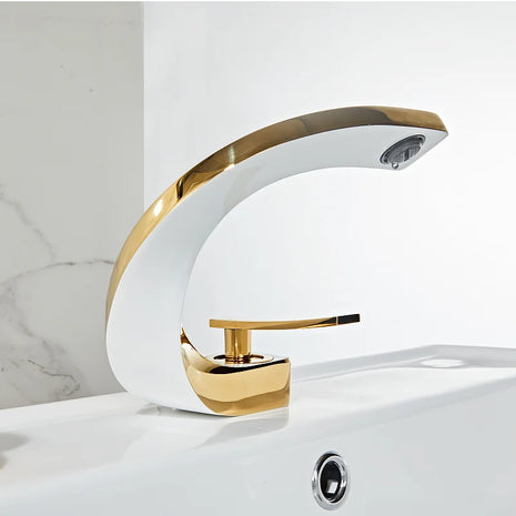 Elegant faucet combining white and rose gold finishes for a luxurious look.

