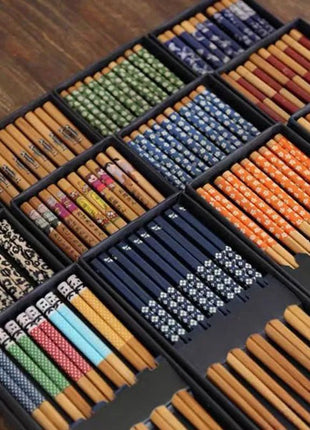 A set of 5 pairs of elegant bamboo chopsticks, perfect for enjoying your favorite Asian dishes.