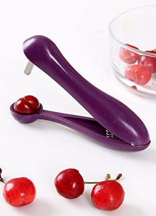  A stylish purple cherry pitter that combines form and function in the kitchen